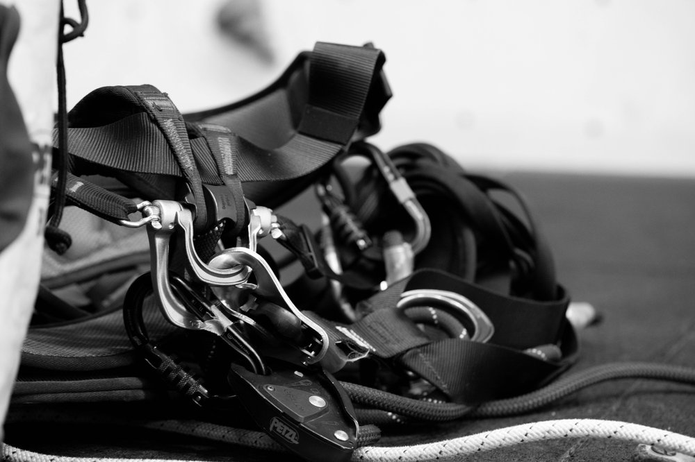 Climbing helmet and harness detail, PPE examined alongside a climbing wall inspection to BS EN 12572