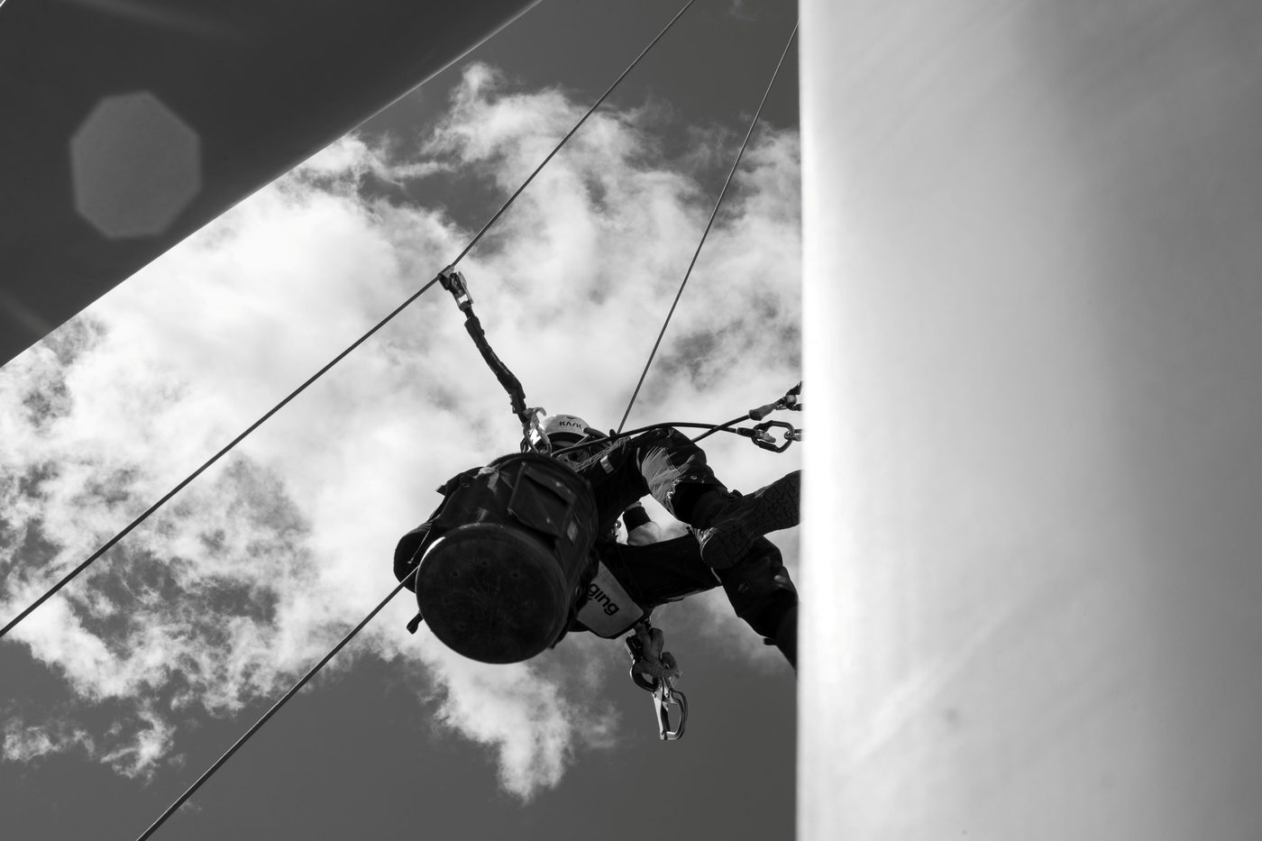 Rope access technician at work on a wind turbine during inspection work